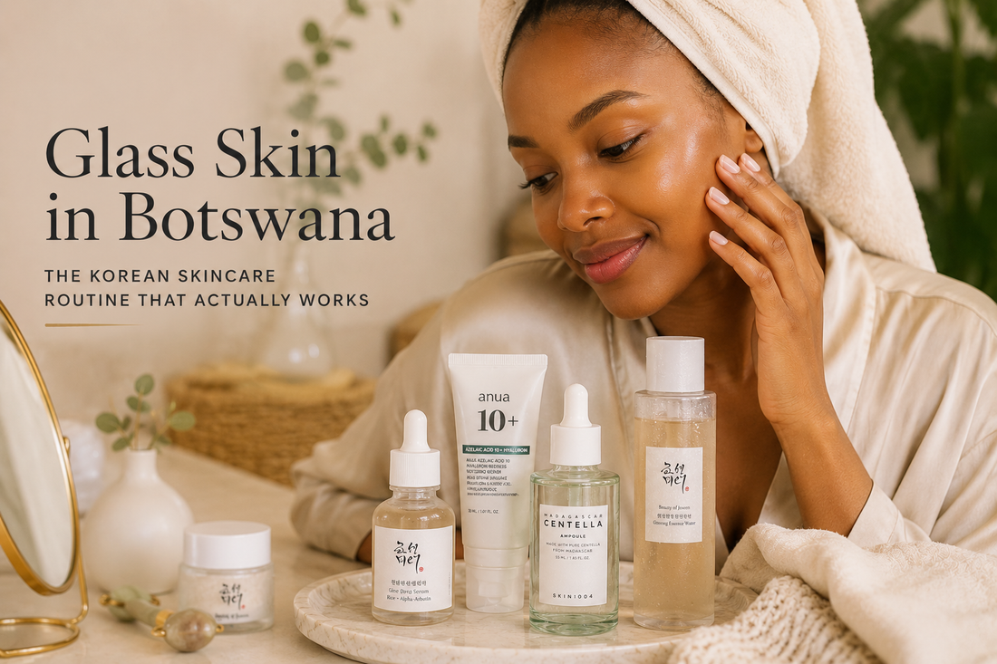 Motswana woman with glowing clear skin following a Korean skincare routine with premium Korean skincare products in a warm minimalist beauty setting.